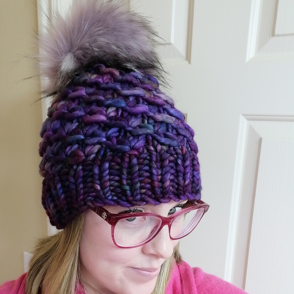 Hand knit merino wool beanie hat with faux fur pom pom